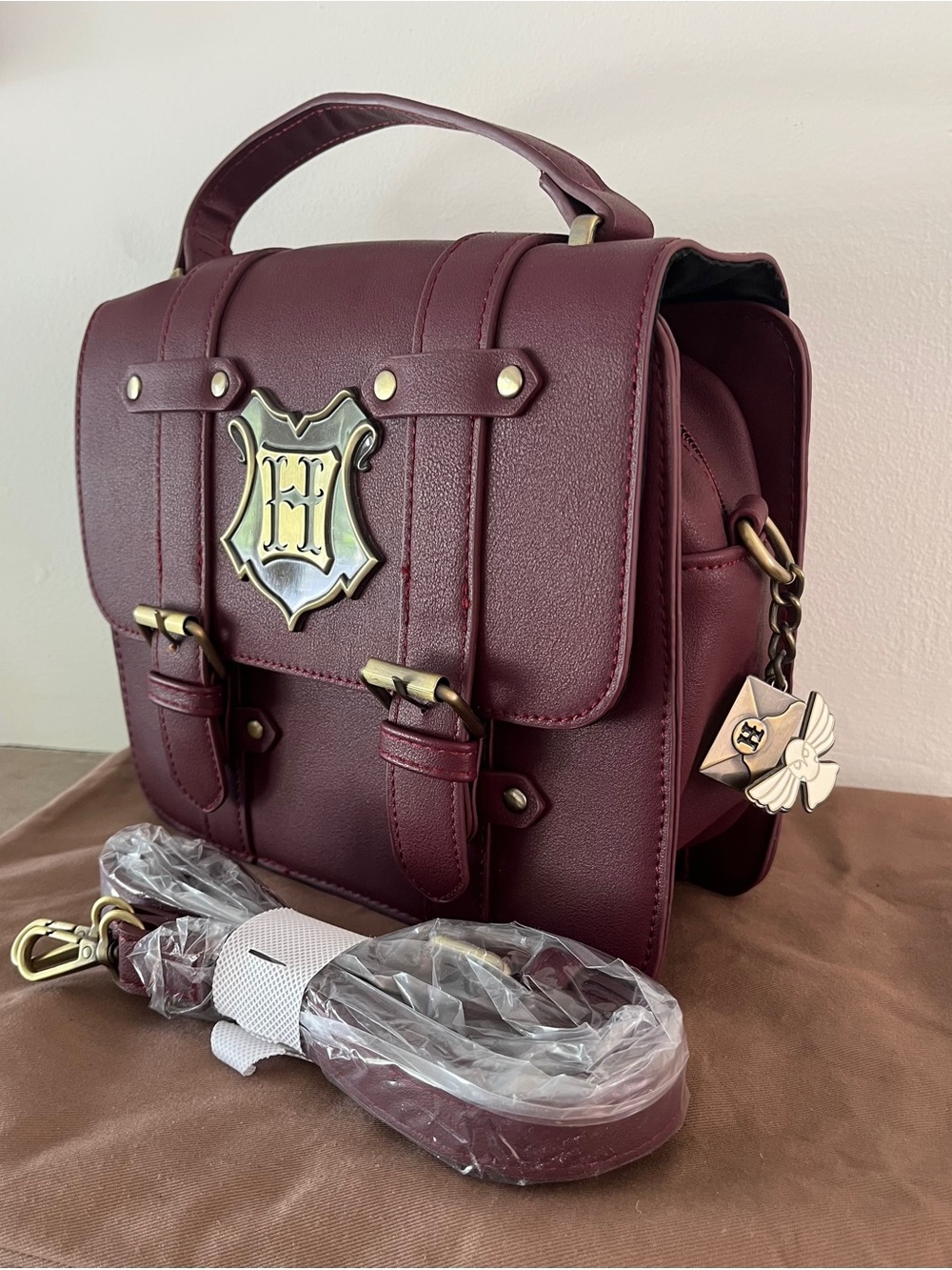 Harry Potter Hogwarts Satchel Handbag with Charms in Maroon. NWOT